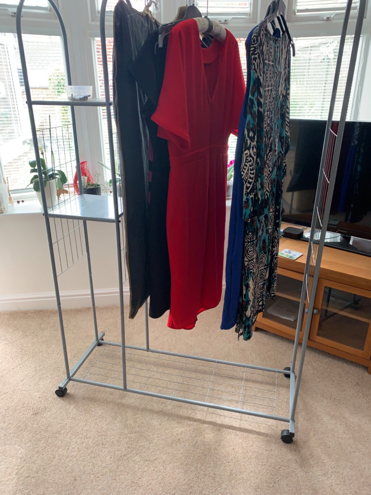 metal clothes rail with shelves. On wheels. Free standing eBay