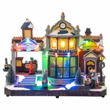 Stazione di Babbo Natale - Villaggio Natalizio con Luci LED, Movimento e Musica 