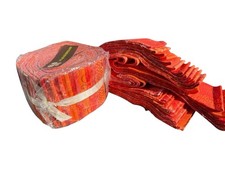 Jelly roll fabrics bundle featuring various orange-toned prints patterns New
