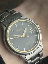 Seiko Titanium Mens SQ50 Vintage Watch 36mm Date Gold Grey 7N42-F060