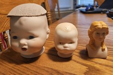 THREE Vintage Bisque Dolls Heads - Larger one Has Glass Blue Eyes