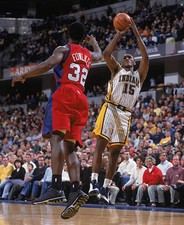 Guard Ron Artest Indiana Pacers shoots the ball as forward Tremai- 2002 Photo