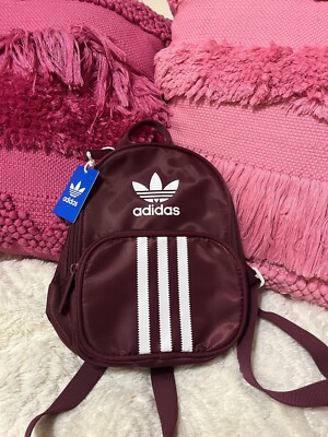 adidas burgundy backpack Striker II Team Step out with confidence and style with the Essentials Material Backpack adidas Striker 3 Backpack -