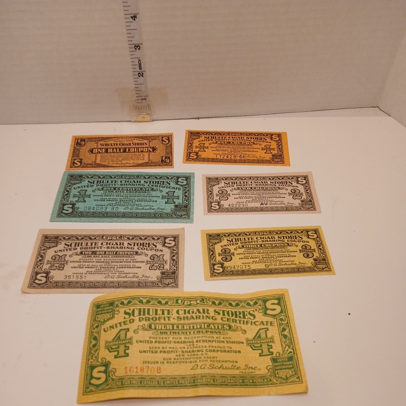 1920’s 7 SCHULTE CIGAR STORES UNITED PROFIT SHARING COUPONS 1/2, 1,1,2,2 1/2,3,4