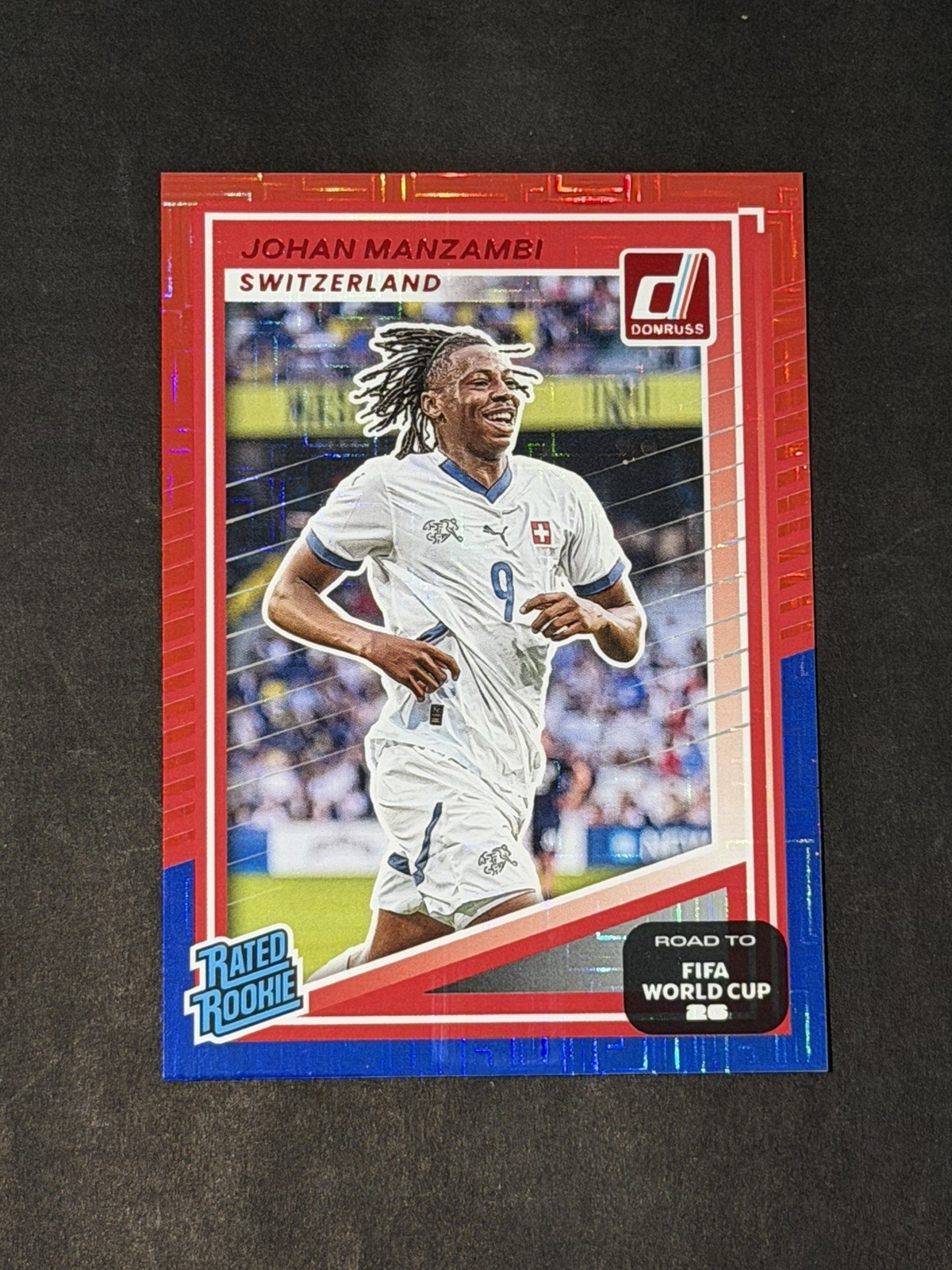 2025-26 Donruss Road to FIFA World Cup Red and Blue Maze Johan Manzambi RC