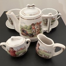 Antique Porcelain Child's Tea set with Pastoral Scenes and Gold Trim