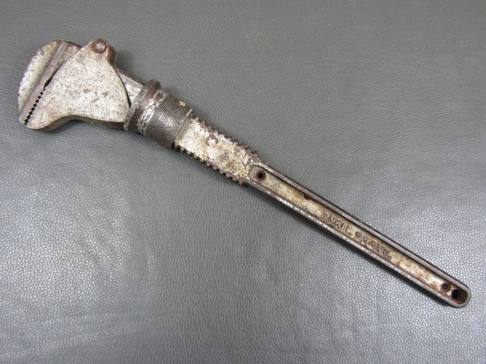 A 13.5" adjustable spanner branded with a literal snail — absurdly charming vintage tool branding that no one else at the flea market has.