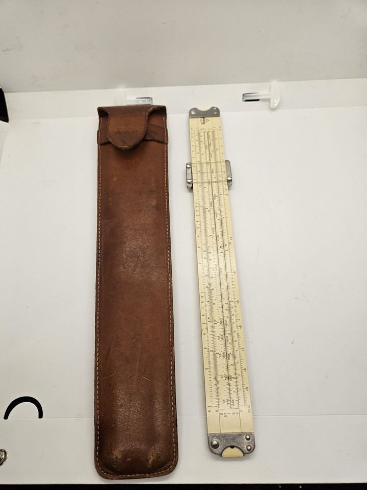 A classic Pickett & Eckel Model 1010 slide rule with its original leather holder — iconic American engineering history you can actually hold in your hand.