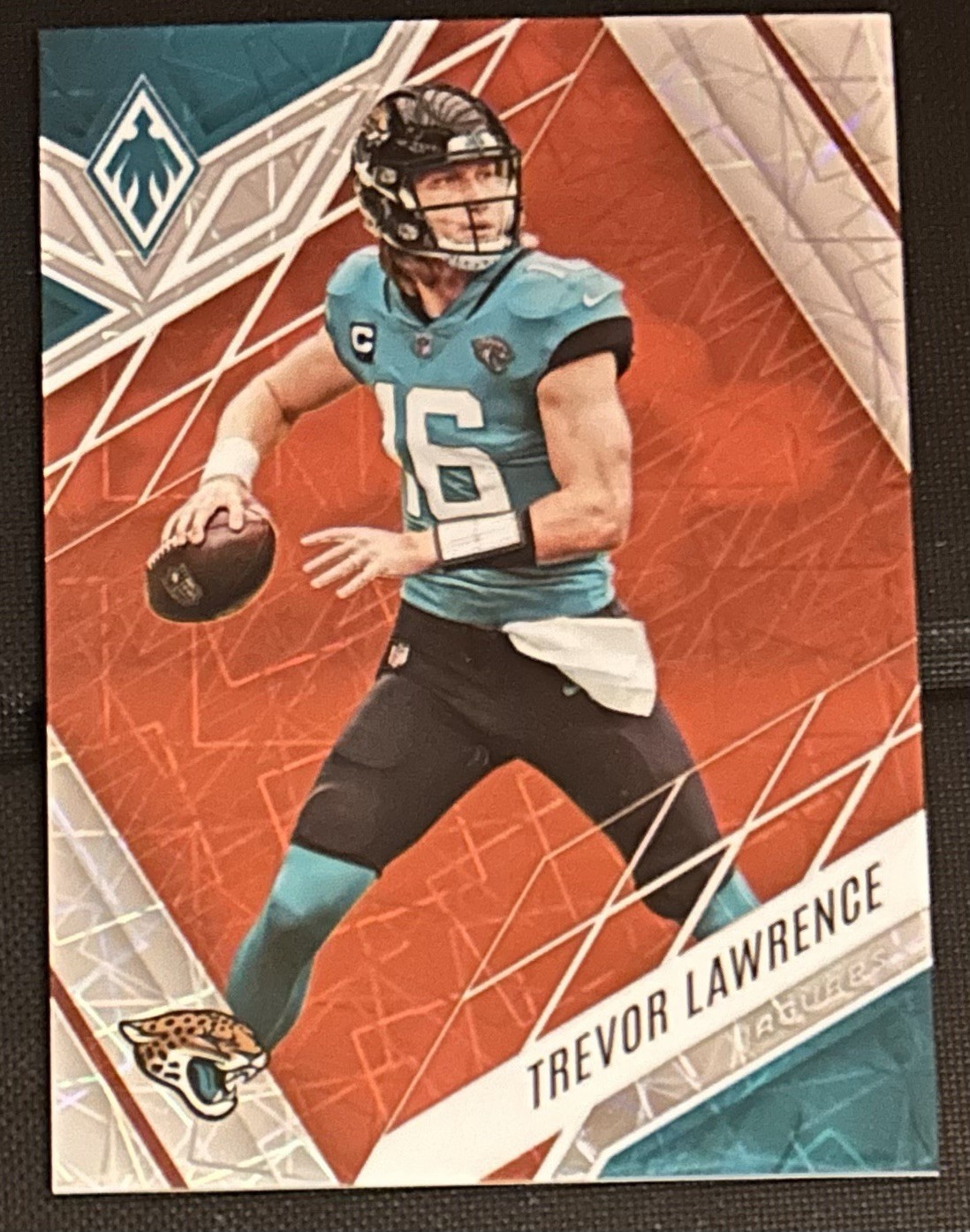 2022 Panini Phoenix Orange Lazer /75 Trevor Lawrence #33 Jacksonville Jaguars