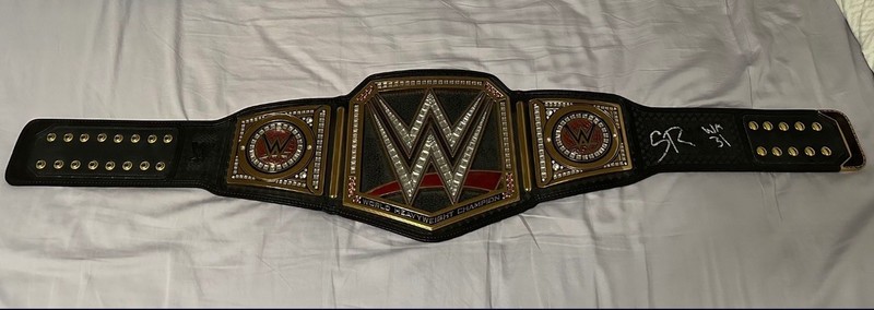 Seth Rollins Signed WWE World Heavyweight Championship With “WM 31” Inscription