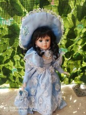 Bambola in porcellana  pari a nuova  Damina con borsetta  h 40cm