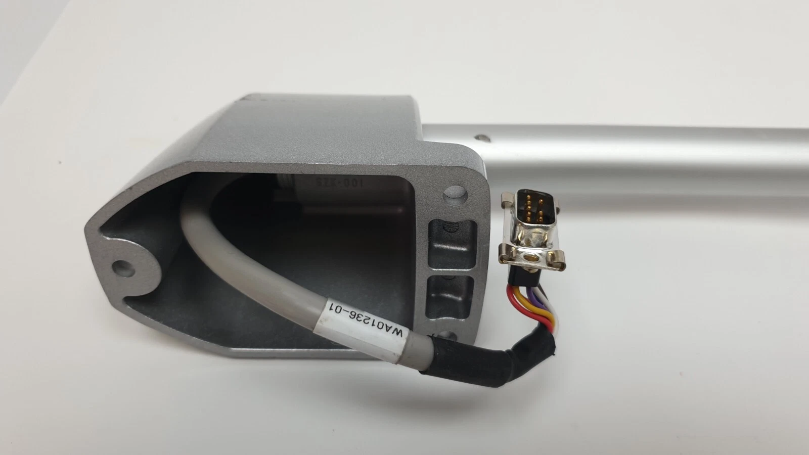 Inside of the die-cast bracket with WA01236-01 tagged cable and D-sub plug
