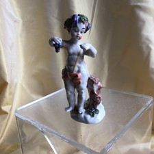 PETIT BACCHUS EN PORCELAINE DE