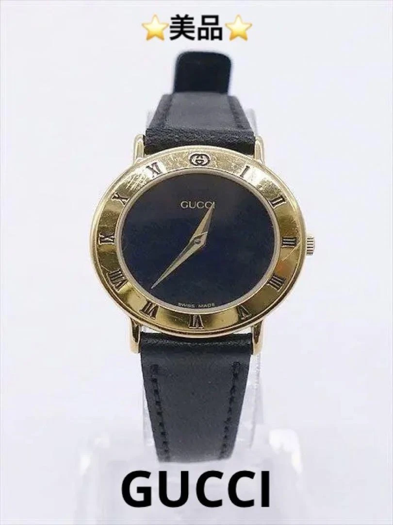 Montre femme Gucci 3148 ceinture dorée noire extérieure