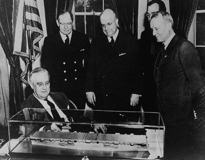 President Franklin D Roosevelt admiring a model of new aircraft ca- Old Photo