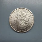 1884-CC MORGAN SILVER DOLLAR. UNCIRCULATED. HIGH GRADE.
