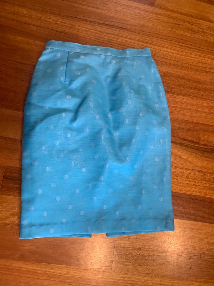 COVERS  Skirt.      Size 10     light blue with slight sheen