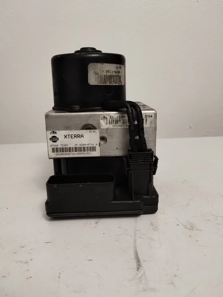 476607Z201 2000 Nissan Xterra ABS Bomba Control Módulo OEM 751-10B3 PRUEBA Foto 3 de 4