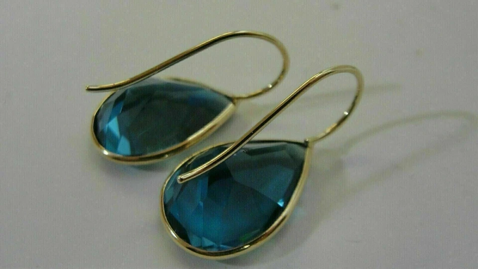 Pendientes colgantes enchapados en oro amarillo de 14 quilates con topacio azul Londres corte pera de 4 quilates Foto 4 de 4