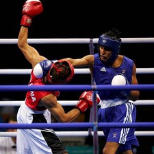 Amir Khan of Britain competes v Marios Kaperonis of Greece during - Old Photo 1