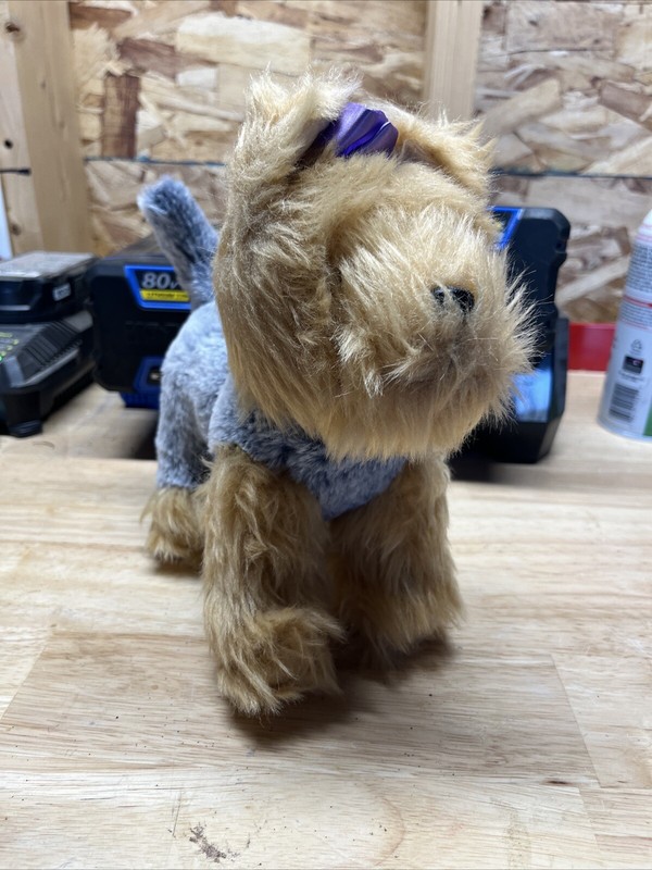 Kids stuffed dog toy with purple ribbon