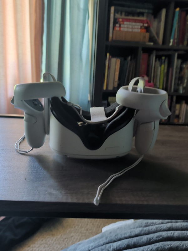 A Used Meta Quest 2 That's In Perfect Condition With Controllers That Work