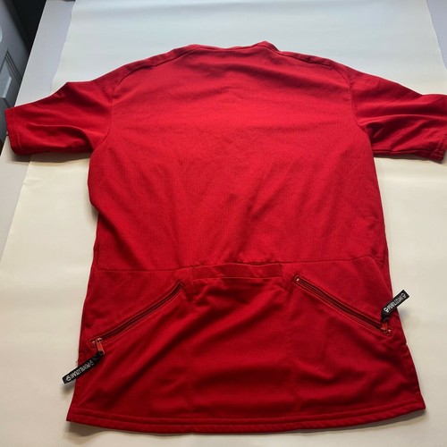 Red mesh Izumi men’s cycling shirt, small size, with back zipper, shown from the lower rear panel.