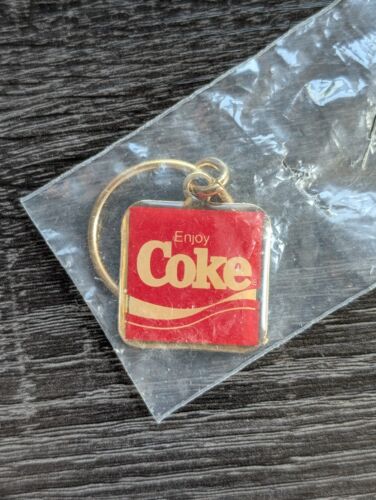 VINTAGE ENJOY COKE COCA~COLA RED GOLD TONE KEYCHAIN 1.25" x 1.25" - SEALED RARE