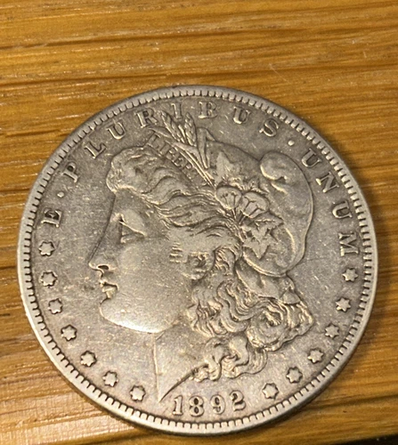 Old Man Duffy’s 1892 s scarce morgan superior very fine+ coin. Lo bid! Get now.