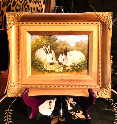 GILT FRAMED PAINTING ON BOARD OF A PAIR OF WHITE RABBITS EATING LETTUCE, 11.5''L