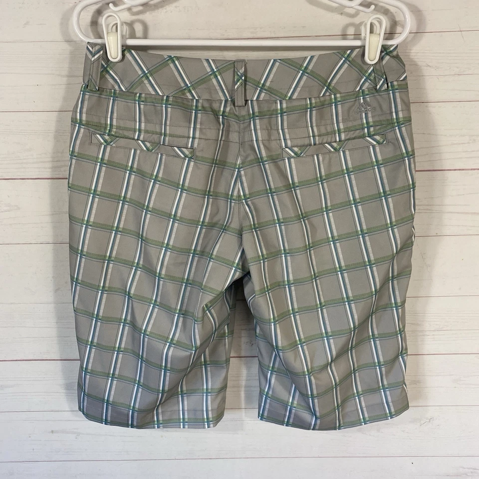 Shorts de golfe Adidas feminino xadrez cinza/verde tamanho 4 bolsos ClimaLite frente plana - Imagem 3 de 4