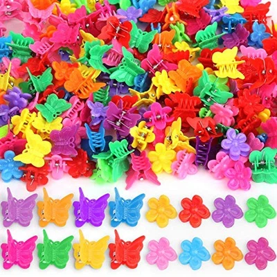 Claw clips shaped like colorful butterfly flowers in red, yellow, pink, purple, orange, and green with metal accents.