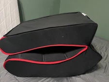 Red and black rocking gaming chair with built in speakers and pockets 