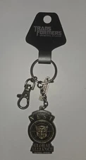 UNIVERSAL STUDIOS TRANSFORMERS SPECIAL PROGRAM NEST GLOBAL ALLIANCE KEYCHAIN NEW