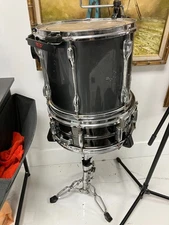 Tama Rockstar series tom drum in a gun metal grey or similar dark finish.