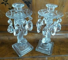 TWO IMPERIAL PRESSED GLASS SERPENT FISH CANDLE STICKS  WITH CRYSTAL RING  ACCENT