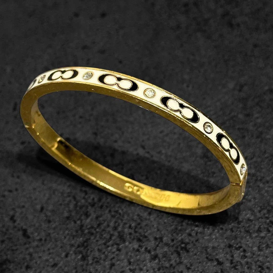 Bracciale con cerniera in pietra firmato COACH