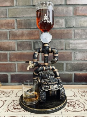Metal Tube Beverage Dispenser. A boy on a quad bike.