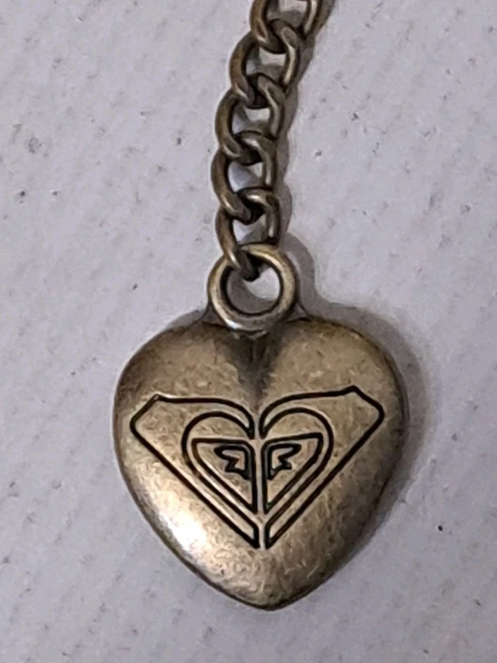 ROXY LOGO Metal CARTERA ENCANTO Antigua Mochila Dorada Vintage CADENA Cierre Llavero Foto 2 de 4