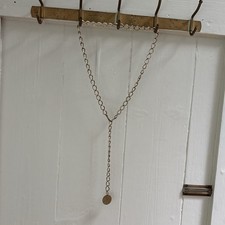Vintage gold chain belt with coin charm, measures 37