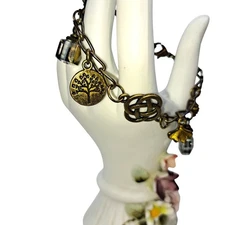 Celtic knot with charms bronze tone tree of life