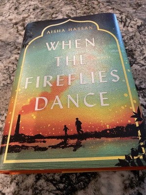 When the Fireflies Dance by Aisha Hassan ( 2025 H/C) Gently Read