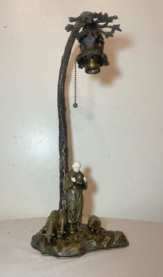 Antique bronze figural sheep herder tree carved electric table lamp sculpture