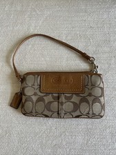 COACH LEATHERWARE BROWN ON TAN SIGNATURE C WRISTLET / WALLET CANVAS LEATHER TRIM