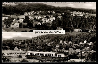 Bad Eilsen, Ortsansicht und Triebwagen vor bewaldeter Kulisse, Ansichtskarte 