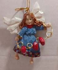 Avon Gift Collection Sparkle Angel Ornament Holding 3 Hearts