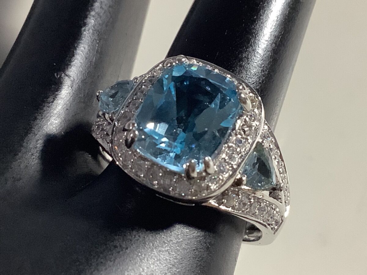 Triangle Blue Topaz Ring Sterling Silver Cubic Zirconia Halo and Side Stones Triangle Blue Topaz Ring Sterling Silver Cubic Zirconia Halo and Side Stones
