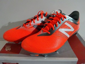 orange new balance football boots