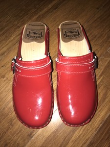 red patent leather mules