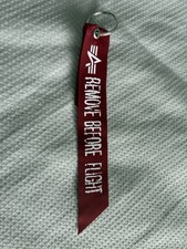 ALPHA INDUSTRIES REMOVE BEFORE FLIGHT TAG